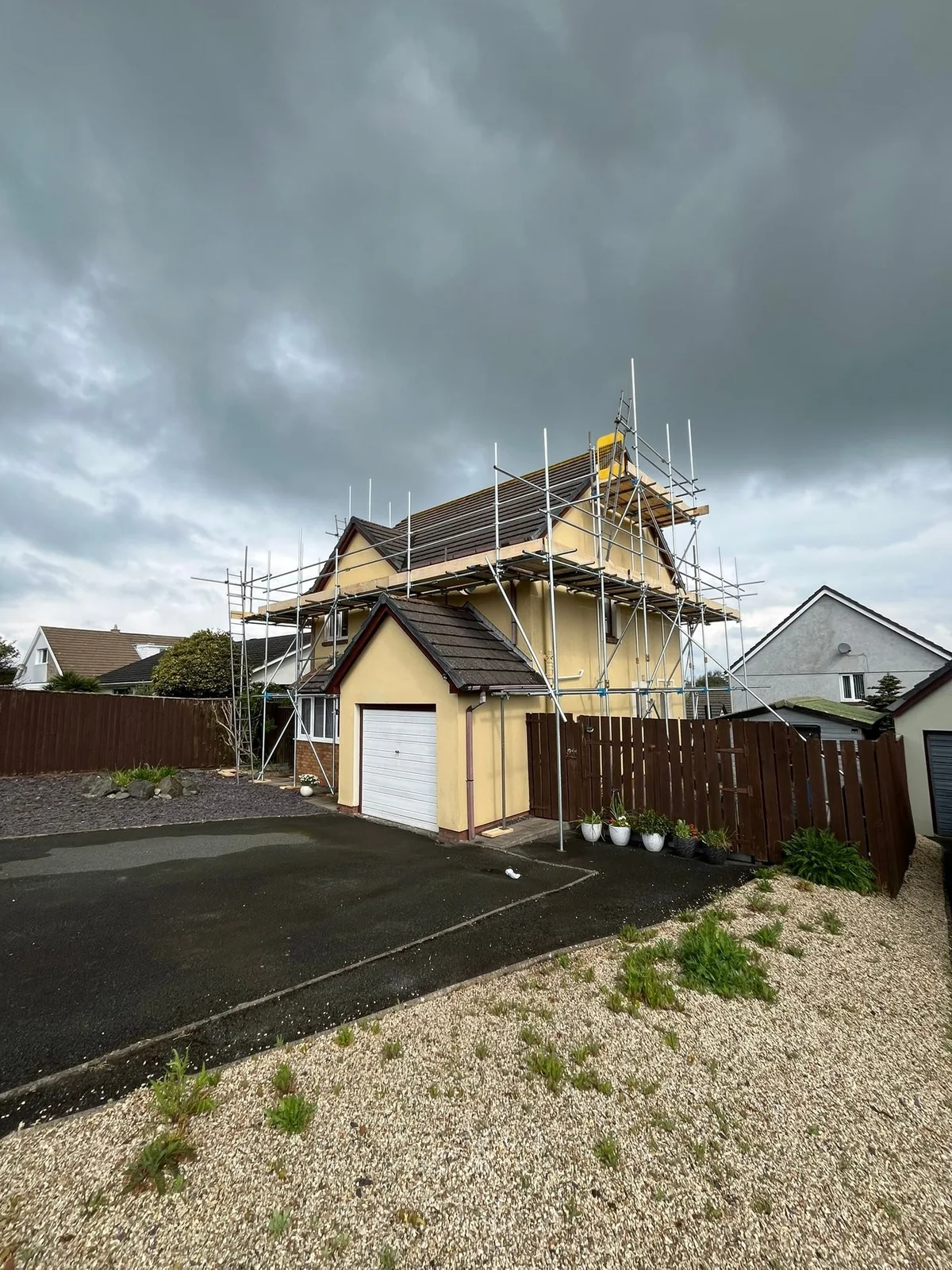 Scaffolding erected around a detached home for exterior work